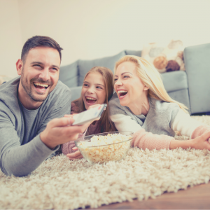 Family watching movies laughing