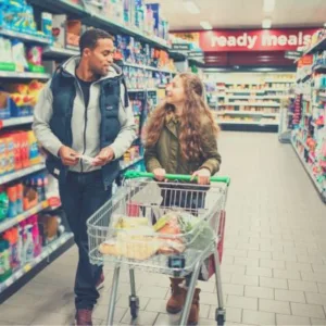 Dad and daughter grocery shopping