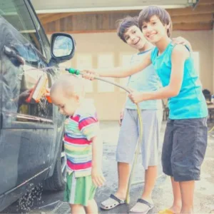 Kids helping to wash the car
