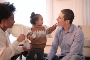 Parents feeding toddler