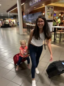 Bri at the airport with her host kid