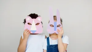 Children pretending to be animals with animal masks