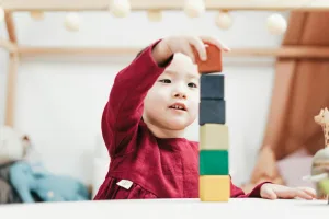 Child playing with building blocks