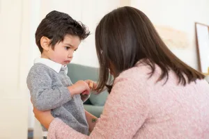 Parent speaking with child.