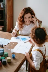 Au Pair and Host Kid crafting