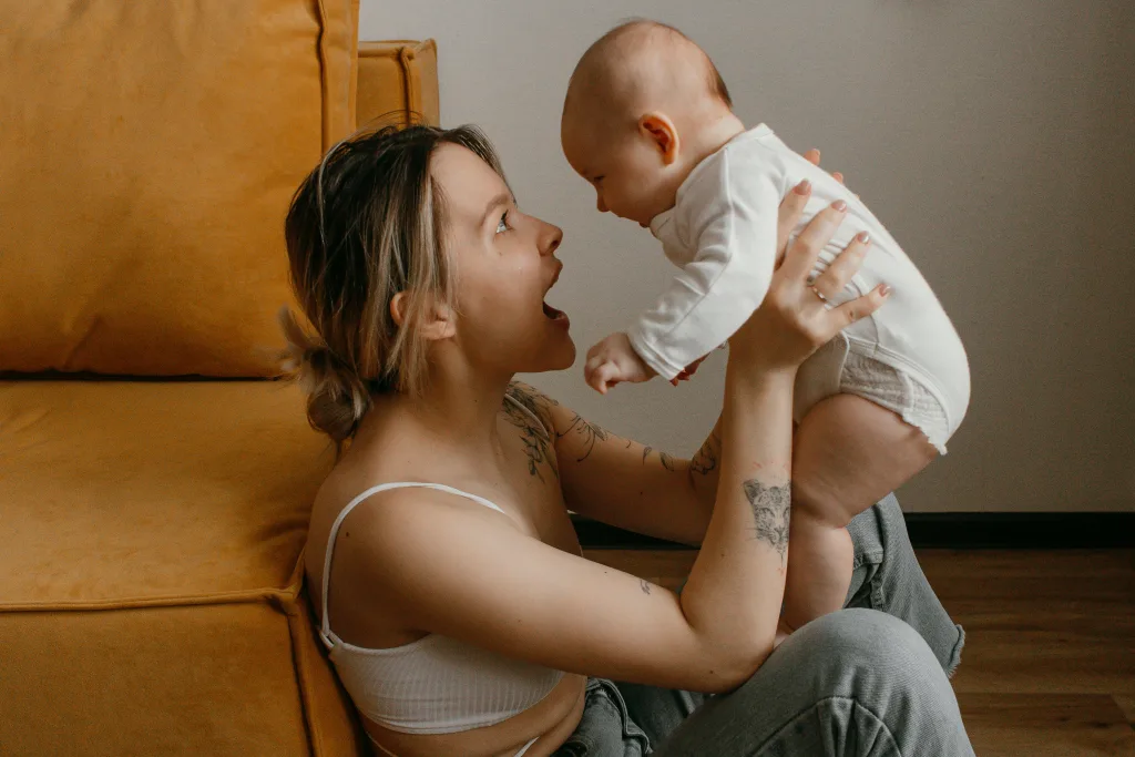 Au Pair playing with baby