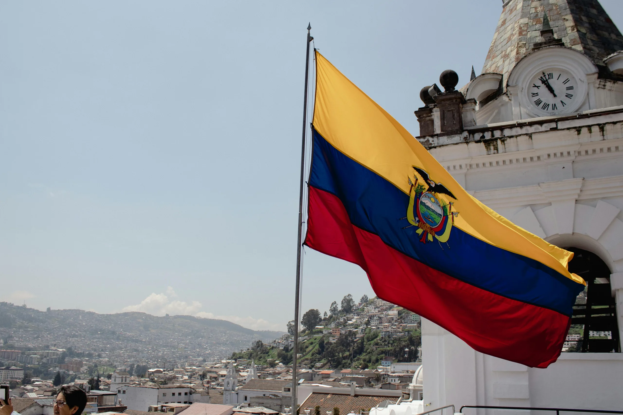 Ecuadorian flag over a city