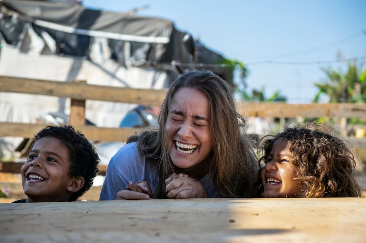 Brazilian Au Pair and children laughing and playing