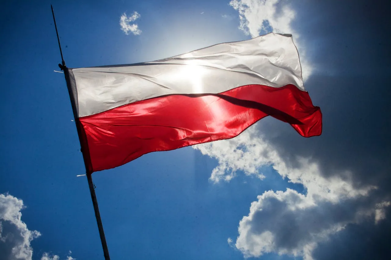 flag of poland against a sunny sky