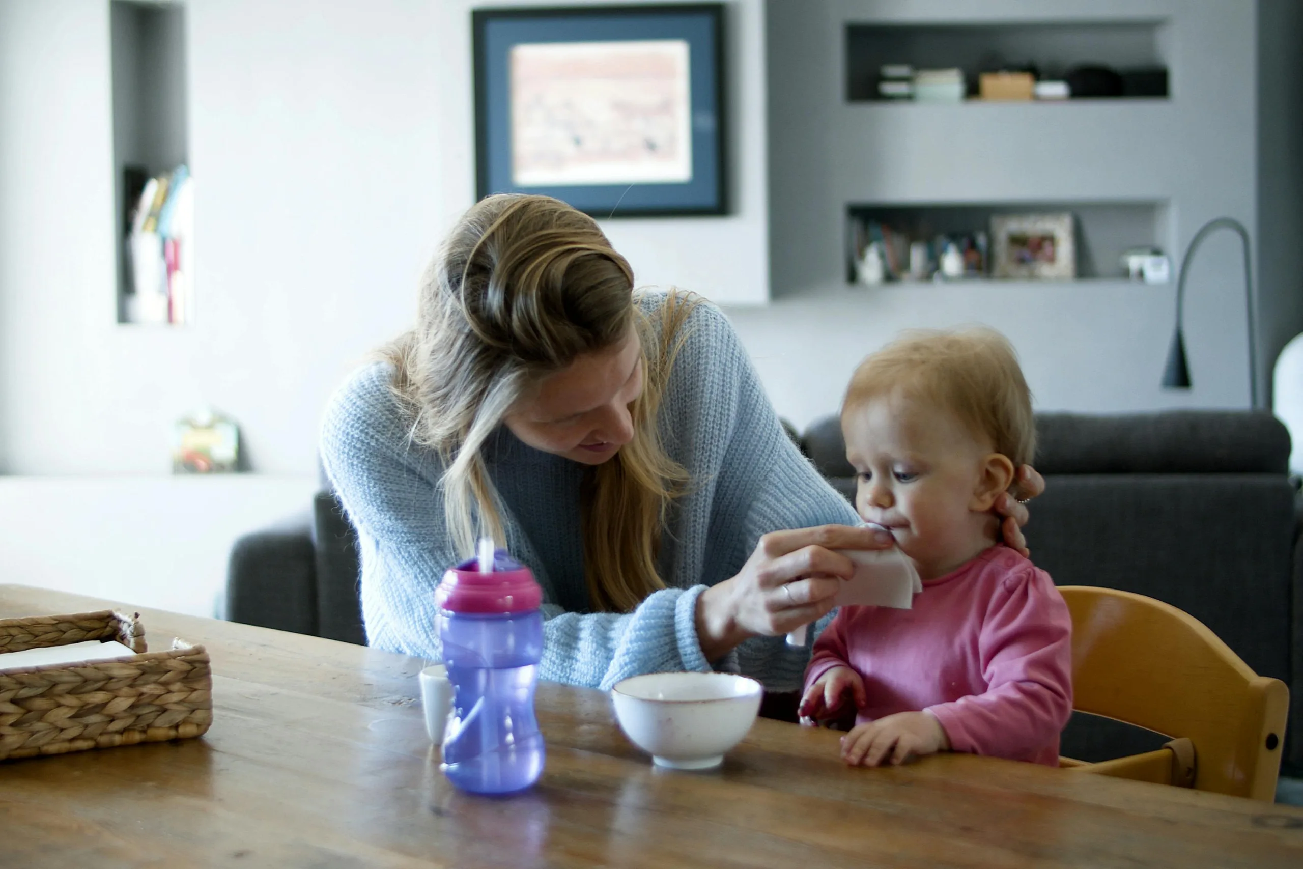 Polish Au Pair helping child with mealtime