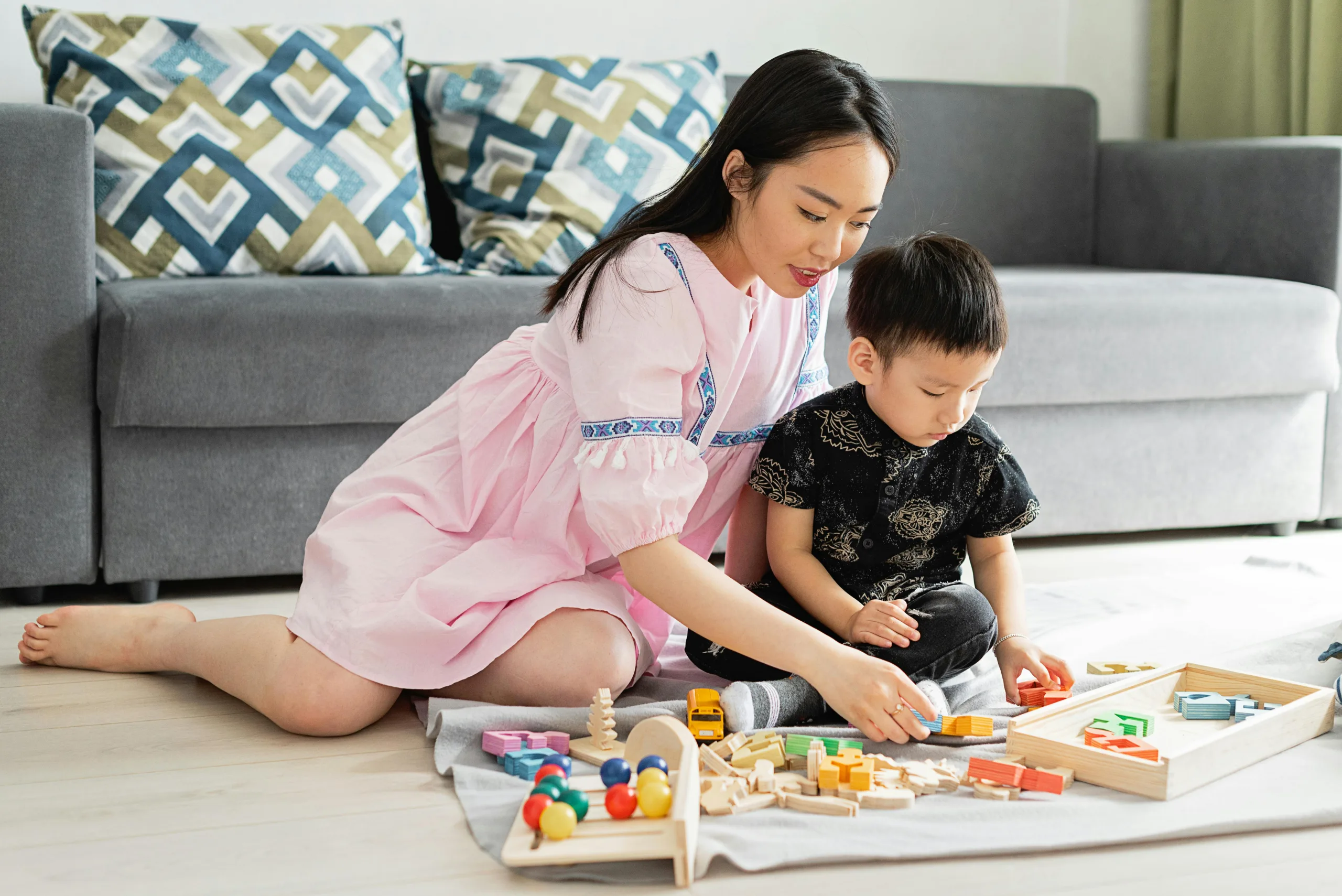 Vietnamese Au Pair playing with child