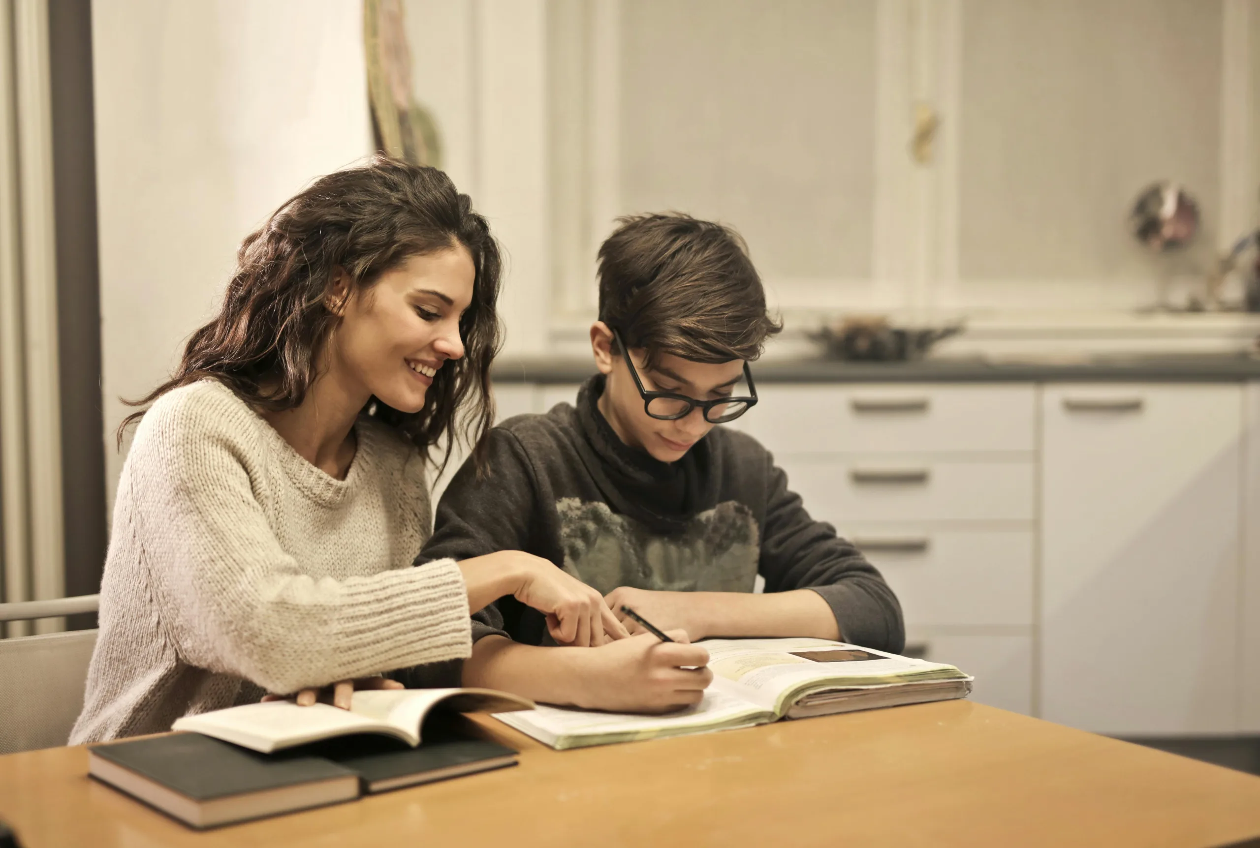 Au Pair helping with child's homework