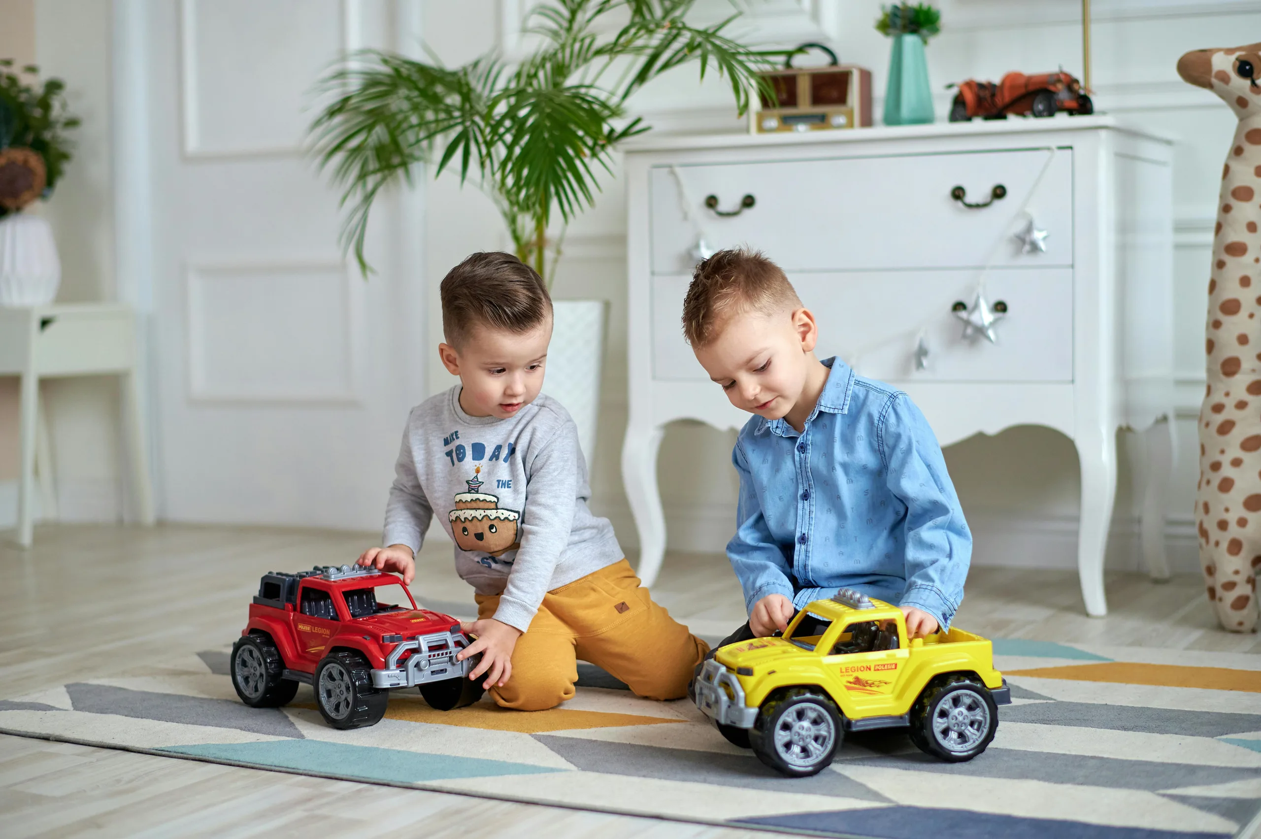 Children playing with cars is a fun activity for kids indoors.