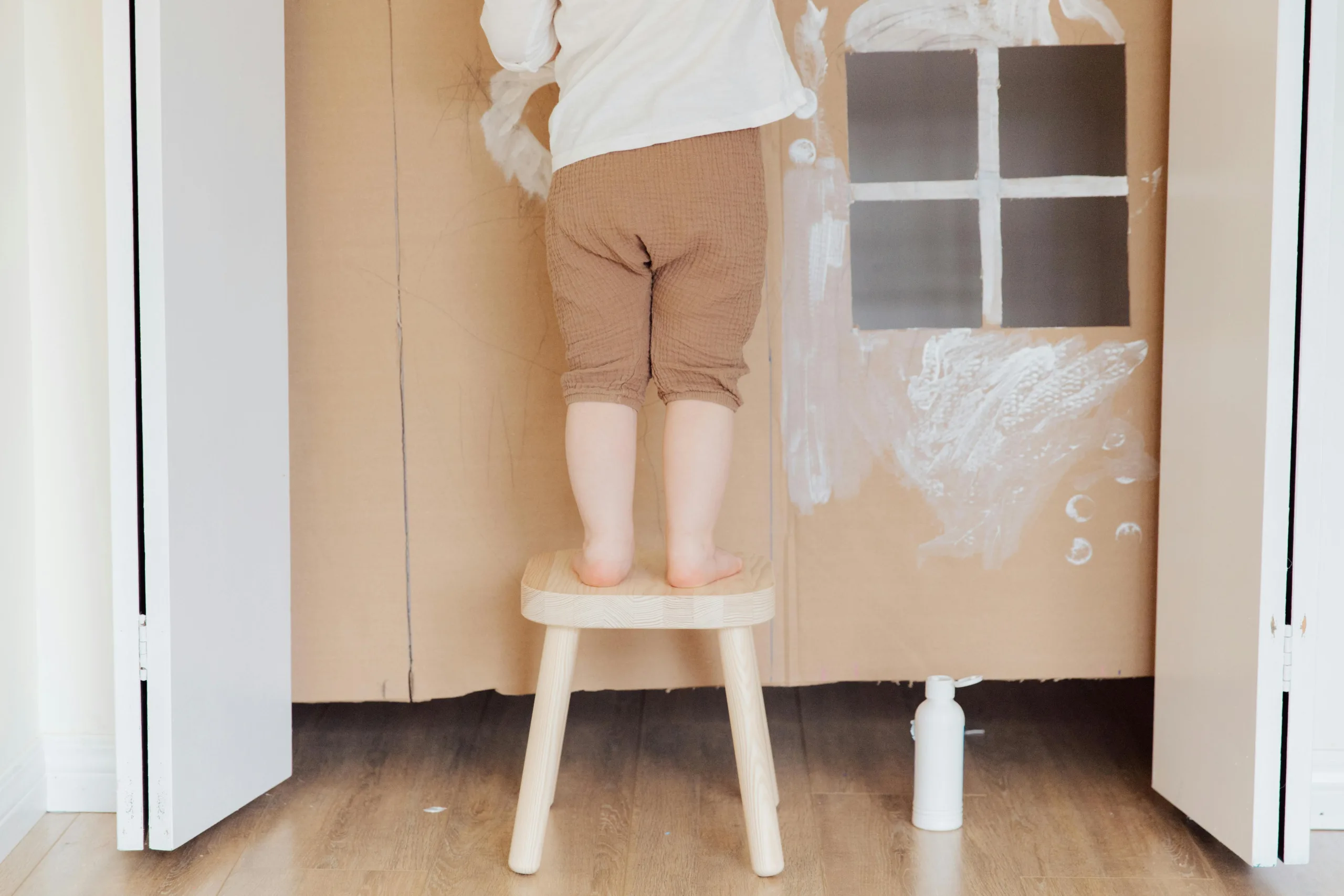 Child climbing on stool. It's important to keep hazards out of children's reach.