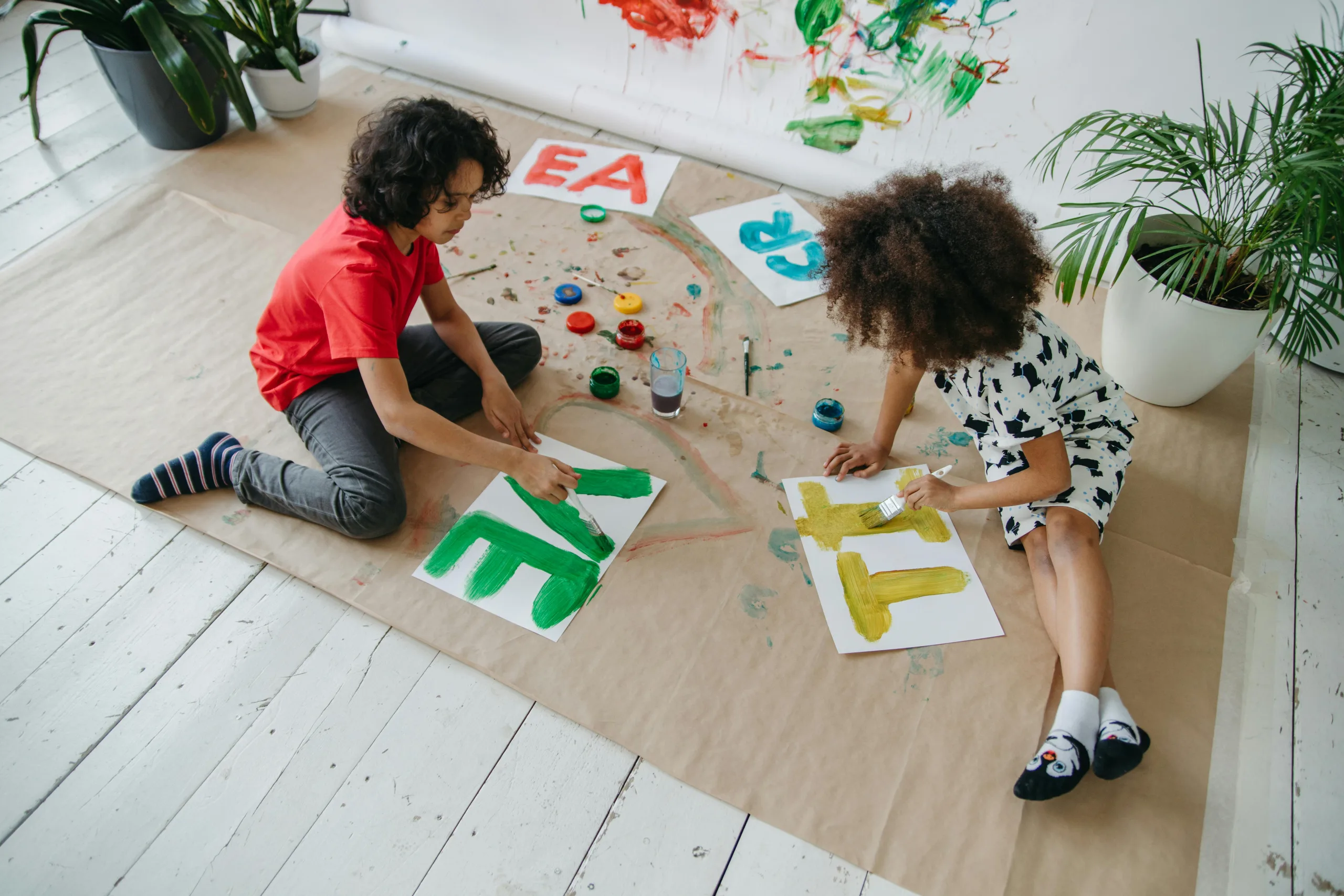 Kids painting letters