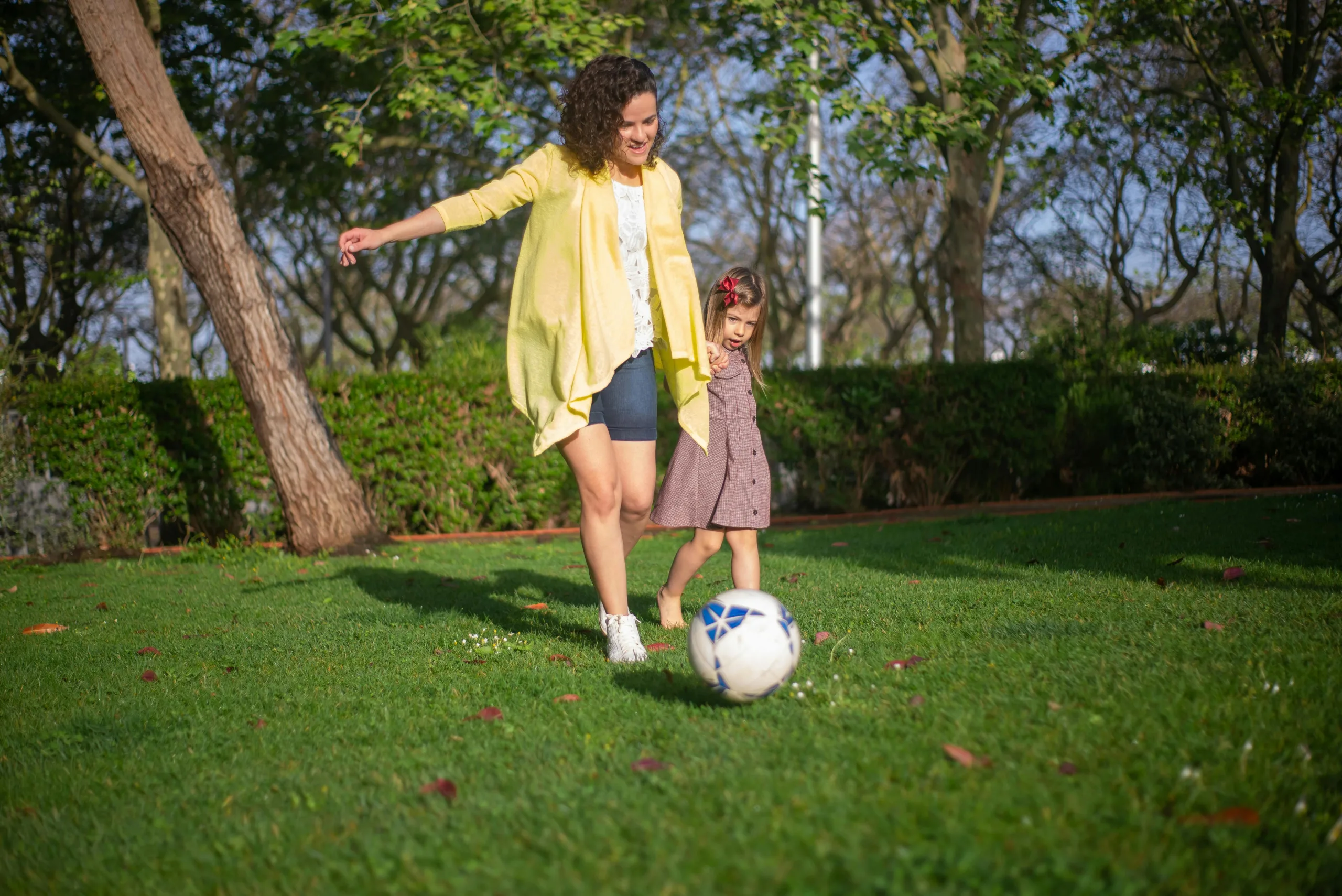 Colombian Au Pair and child playing soccer