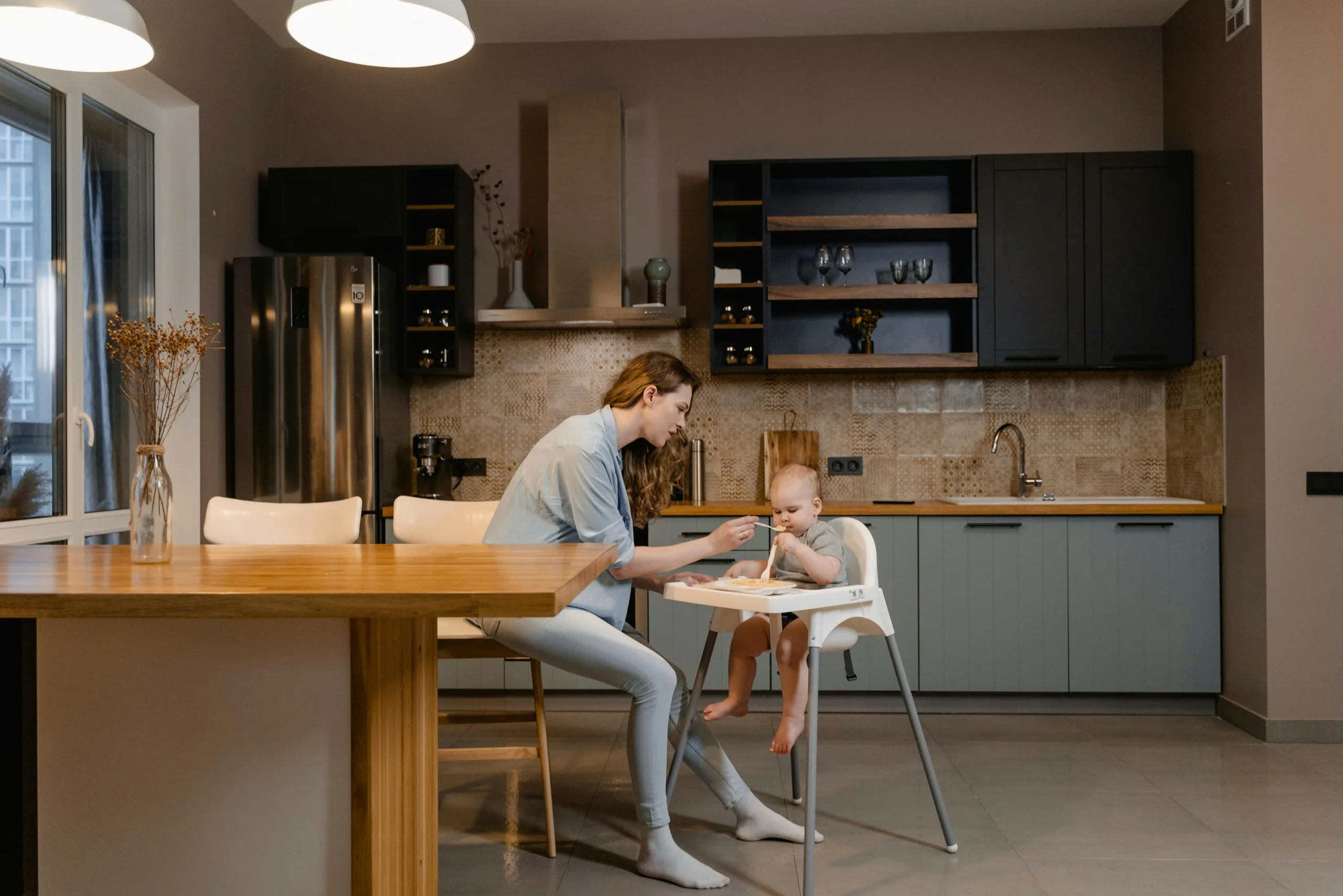 Au Pair helping child with breakfast